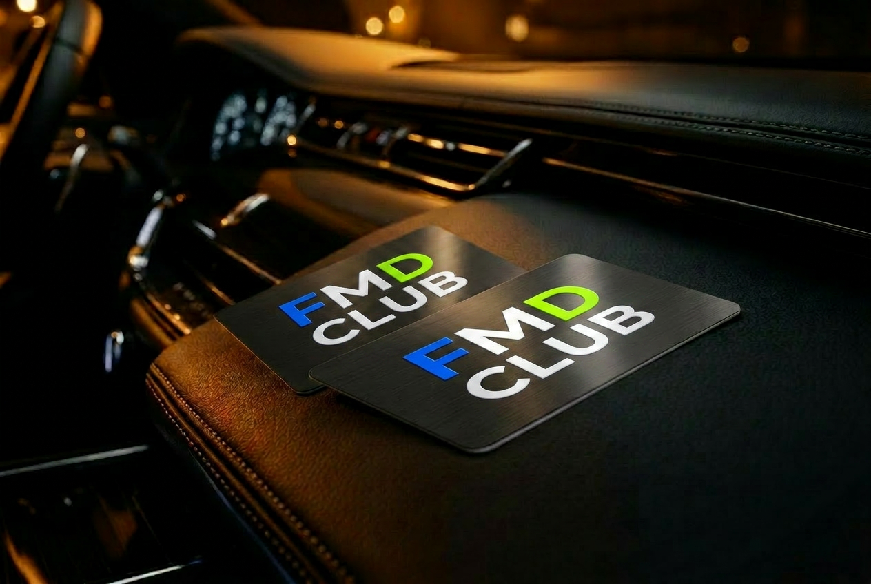 FMD membership cards on luxury car dashboard